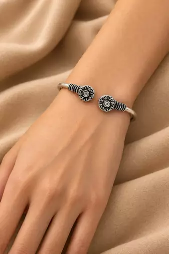 German silver oxidized floral motif clear kada bracelet
