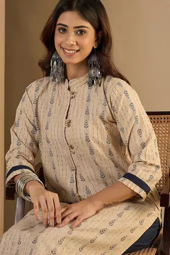 Cream blended cotton ethnic motifs free size suit
