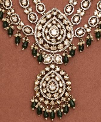 Royal polki kundan green stone layered necklace set with maang tikka 2