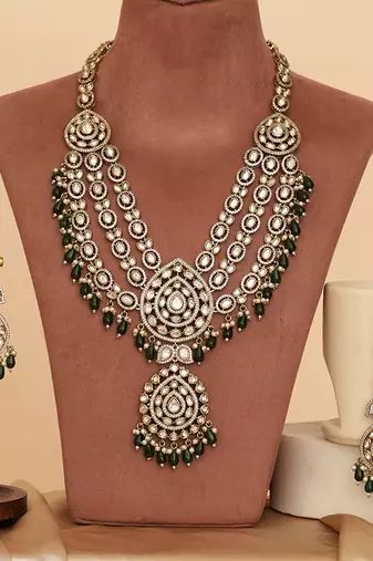 Royal polki kundan green stone layered necklace set with maang tikka