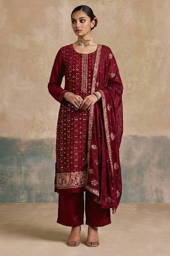 Magenta georgette embroidered top with multi thread and sequins work along with khatli work on neckline free size suit