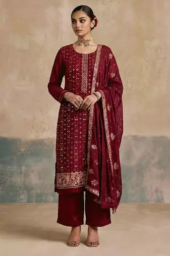 Magenta georgette embroidered top with multi thread and sequins work along with khatli work on neckline free size suit