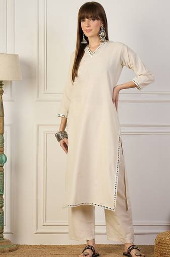 Beige blended cotton solid & mirror work on nackeline free size suit