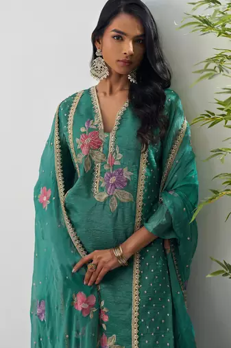 Green fancy fabric thraed embroidery   beads & sequins free size suit