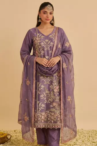 Purple silk blend embroidered   multi thread and sequins work heavy floral motifs gold zari work free size suit