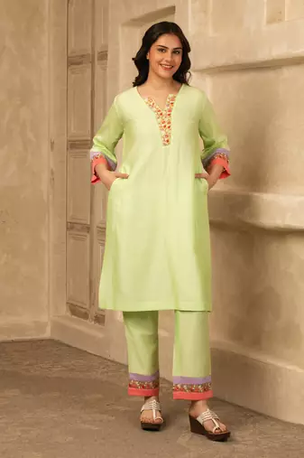Green cotton kurta set with floral embroidery lace detailings