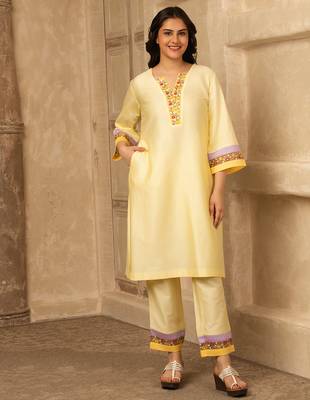 Yellow cotton kurta set with floral embroidery lace detailings 1