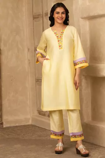 Yellow cotton kurta set with floral embroidery lace detailings