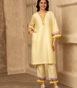Yellow cotton kurta set with floral embroidery lace detailings