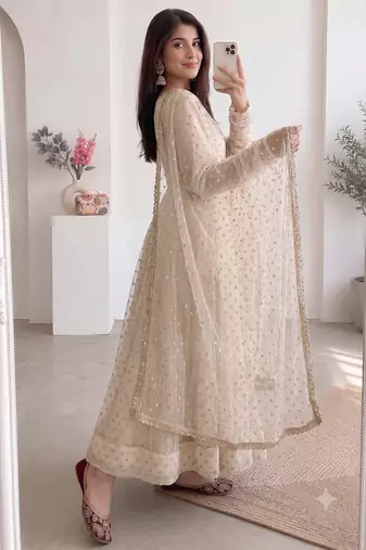 Women cream polka dot anarkali suit with solid trouser pant & border dupatta