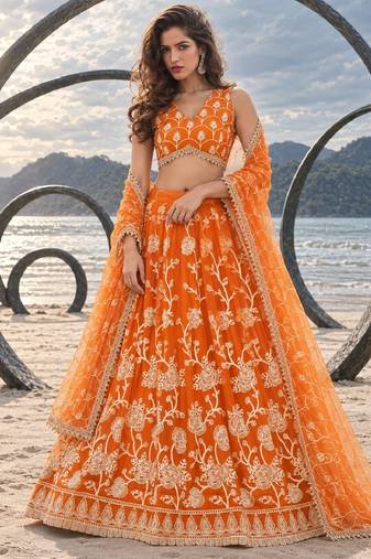 ORANGE NET THREAD WITH ZARI AND SEQUIN WORK FESTIVE LEHENGA CHOLI