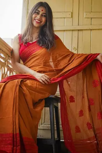 Yellow orange linen jacuard work festival saree with unstitched blouse piece
