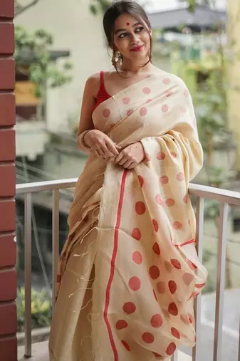 Cream red linen jacuard work festival saree with unstitched blouse piece