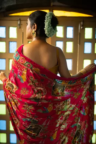 Madhavi- red crepe saree with cutdana work hand embroidery 