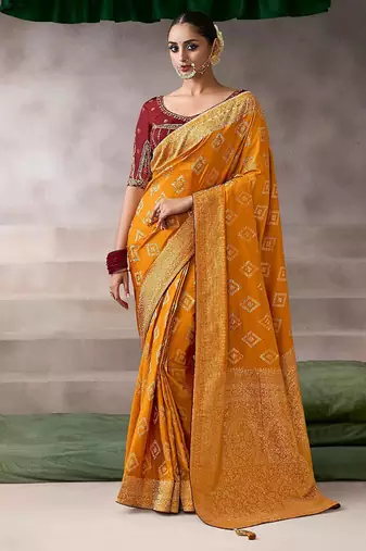 mustard crepe designer saree with patterned blouse
