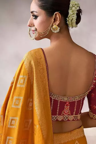 mustard crepe designer saree with patterned blouse