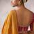 mustard crepe designer saree with patterned blouse