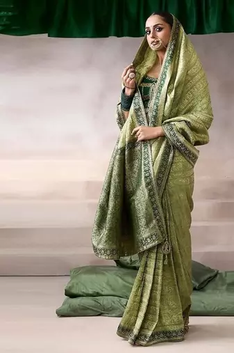 olive crepe designer saree with patterned blouse