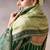 olive crepe designer saree with patterned blouse