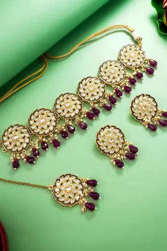 purple kundan choker necklace set with earrings and maangtika