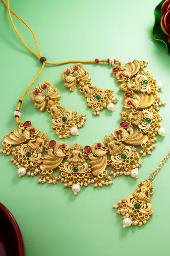 antique gold lakshmi temple necklace set with earrings and maangtika