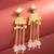 kundan pink meenakari dangle earrings with chain tassels