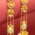 long kundan chandelier earrings with yellow bead tassels