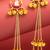maroon crescent moon kundan chandelier earrings with gold bell tassels