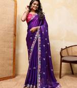 Royal purple embroidered saree with multicolor floral border & rani pink blouse