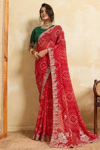 Red bandhani print saree with multicolor embroidered border & green blouse