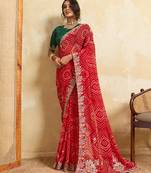 Red bandhani print saree with multicolor embroidered border & green blouse