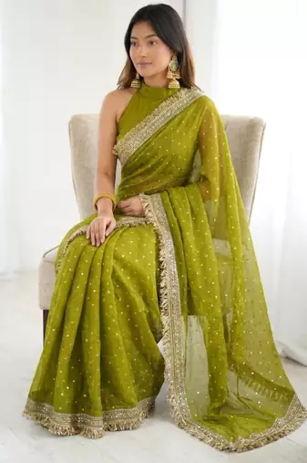 Mehendi green embellished saree with gold fringe border & matching blouse