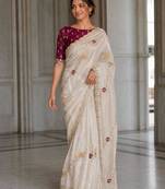 Ivory white embroidered saree with multicolor motifs & magenta blouse