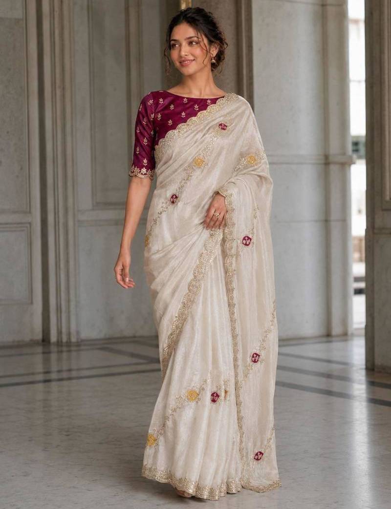 Ivory white embroidered saree with multicolor motifs & magenta blouse
