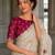 Ivory white embroidered saree with multicolor motifs & magenta blouse