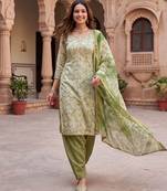 green ethnic graceful shimmer linen cotton suit for girls