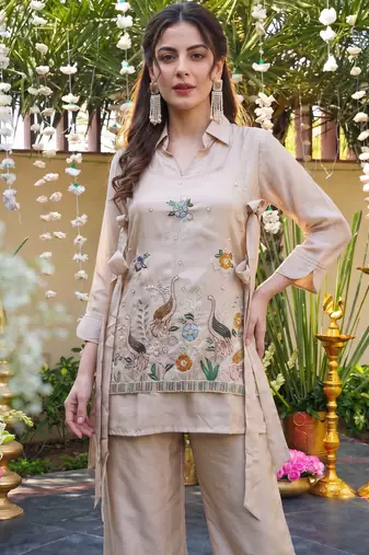 Cream color viscose fabric designer embroidery work graceful partywear attire for girls