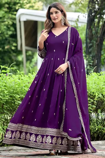 Purple color fancy ceremonial art silk fabric gown with dupatta