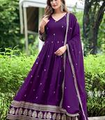 Purple color fancy ceremonial art silk fabric gown with dupatta