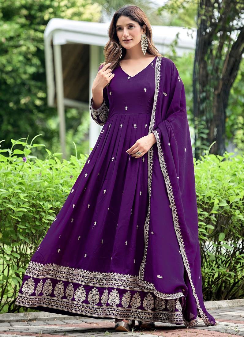 Purple color fancy ceremonial art silk fabric gown with dupatta