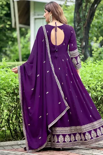 Purple color fancy ceremonial art silk fabric gown with dupatta