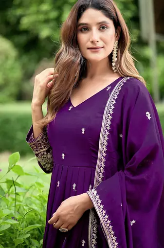 Purple color fancy ceremonial art silk fabric gown with dupatta