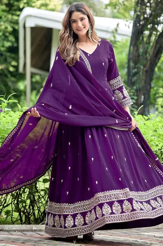 Purple color fancy ceremonial art silk fabric gown with dupatta