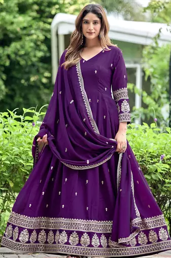 Purple color fancy ceremonial art silk fabric gown with dupatta