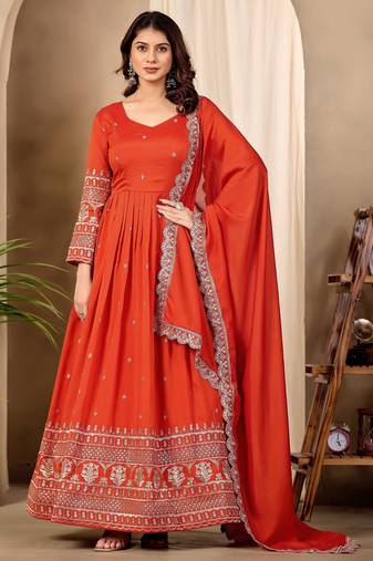 Rust color fancy ceremonial art silk fabric gown with dupatta