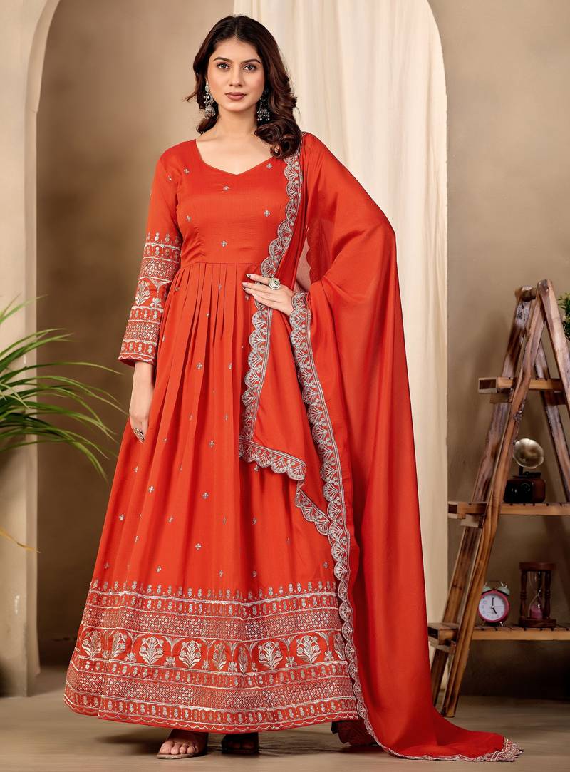 Rust color fancy ceremonial art silk fabric gown with dupatta