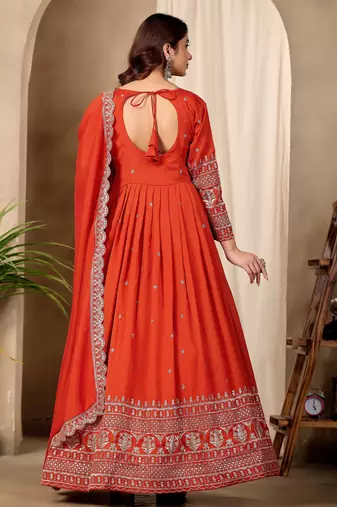Rust color fancy ceremonial art silk fabric gown with dupatta