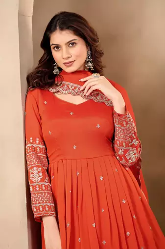 Rust color fancy ceremonial art silk fabric gown with dupatta