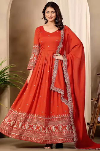 Rust color fancy ceremonial art silk fabric gown with dupatta