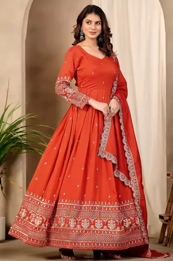 Rust color fancy ceremonial art silk fabric gown with dupatta